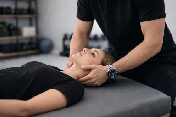 Physiotherapist treating back and neck pain