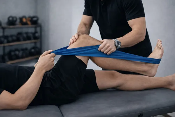 Physiotherapist treating leg, foot and ankle pains